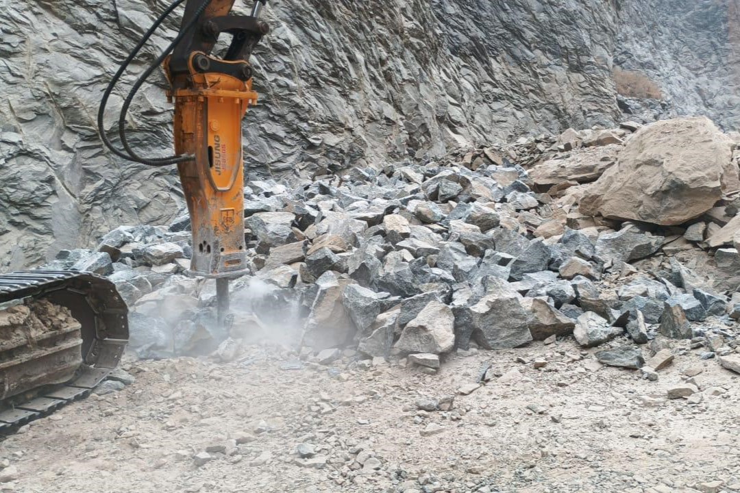 Mining site with heavy machinery and workers